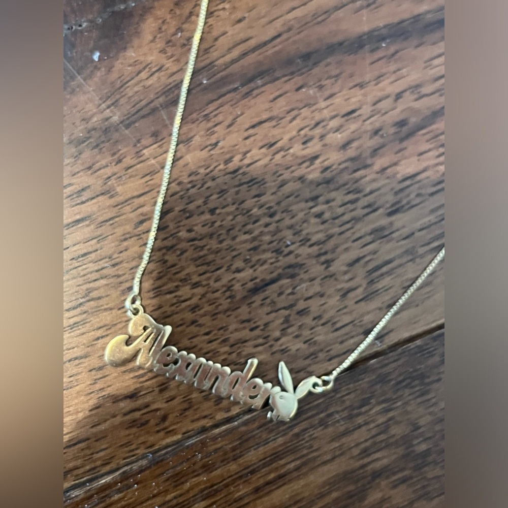 Gold chain with “Alexander” name plate and play boy bunny